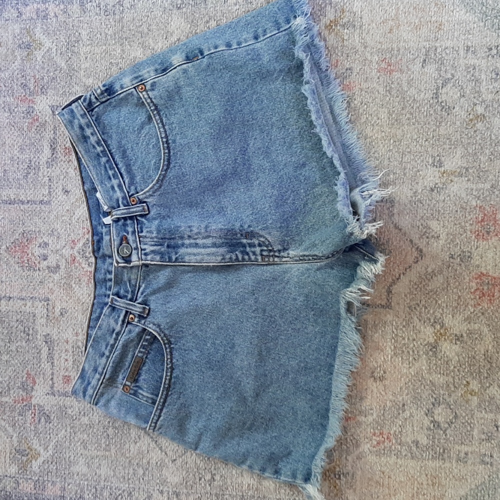 High rise Calvin Klein ladies cut off jean shorts size 13